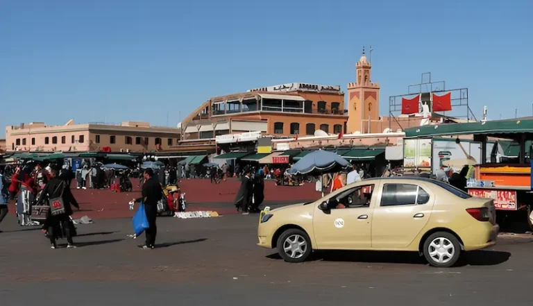 A vibrant street in Marrakech showcasing various modes of transportation. In the foreground a